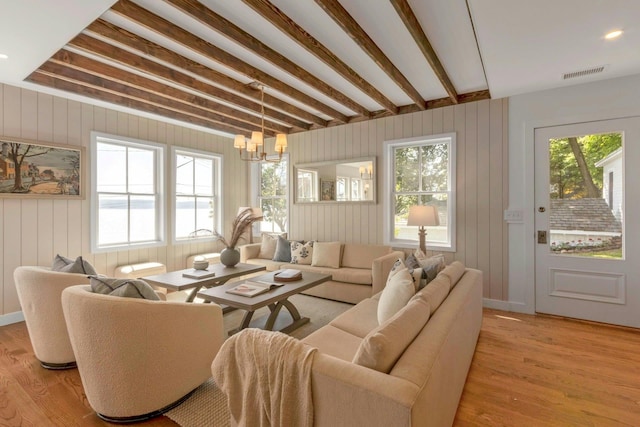 115 River Rd, Nyack, NY 10960 - living room with healthy amount of natural light, a chandelier, and light wood finished floors