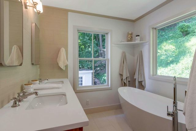 115 River Rd, Nyack, NY 10960 - full bath with a soaking tub, double vanity, and crown molding