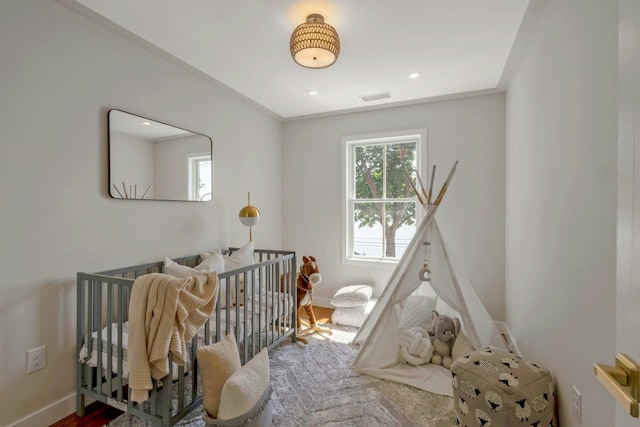 115 River Rd, Nyack, NY 10960 - bedroom featuring a crib, wood finished floors, and recessed lighting