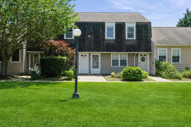 1000 Ninth St Unit H63, Greenport, NY 11944 - colonial inspired home with a shingled roof and a front lawn