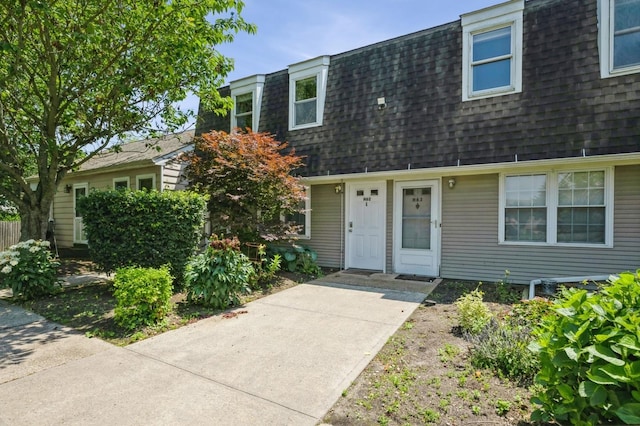 1000 Ninth St Unit H63, Greenport, NY 11944 - view of front of home with roof with shingles and mansard roof