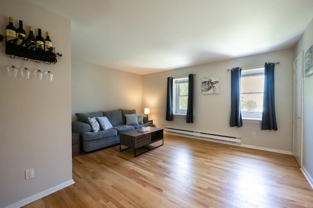 1000 Ninth St Unit H63, Greenport, NY 11944 - living area with baseboard heating and light wood-style flooring