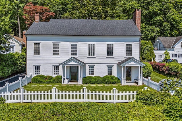 50 Shore Rd, Cold Spring Harbor, NY 11724 - colonial inspired home with a chimney and a fenced front yard