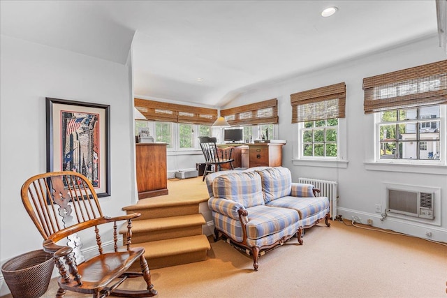 50 Shore Rd, Cold Spring Harbor, NY 11724 - living area with radiator, plenty of natural light, lofted ceiling, a wall mounted AC, and carpet
