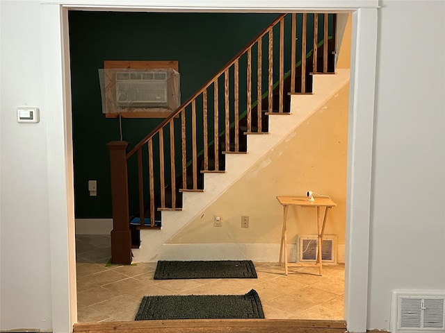 42 Columbia St, Poughkeepsie, NY 12601 - staircase with tile patterned floors and baseboards