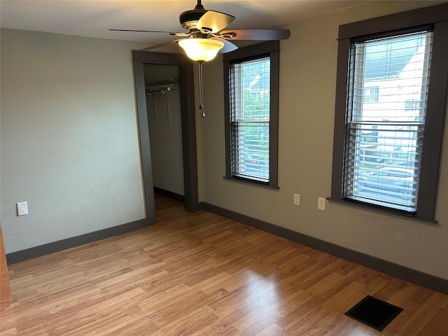 42 Columbia St, Poughkeepsie, NY 12601 - empty room with a ceiling fan and light wood-style floors