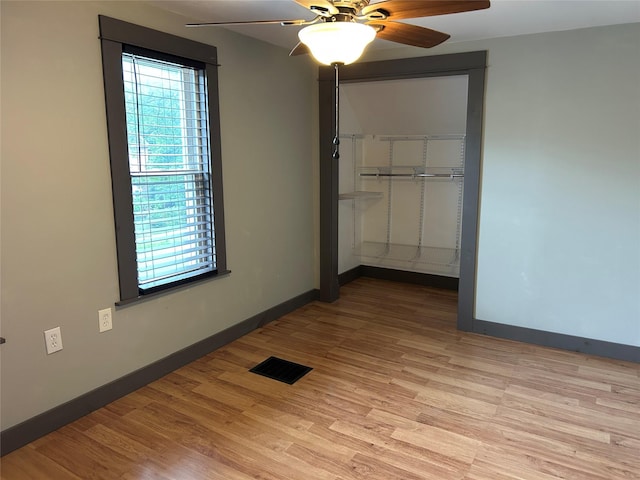 42 Columbia St, Poughkeepsie, NY 12601 - unfurnished bedroom with a closet, light wood finished floors, and a ceiling fan