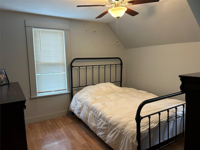 42 Columbia St, Poughkeepsie, NY 12601 - bedroom featuring wood finished floors, vaulted ceiling, and a ceiling fan