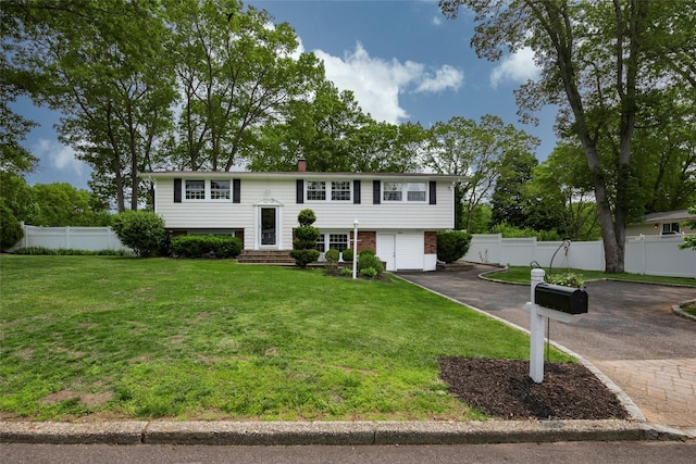 3 Twig Ct, East Setauket, NY 11733 - split foyer home featuring driveway, a chimney, and brick siding