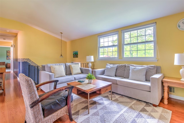 3 Twig Ct, East Setauket, NY 11733 - living room featuring wood finished floors and vaulted ceiling