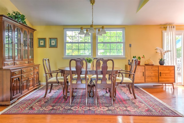 3 Twig Ct, East Setauket, NY 11733 - dining area featuring healthy amount of natural light, wood finished floors, and a chandelier