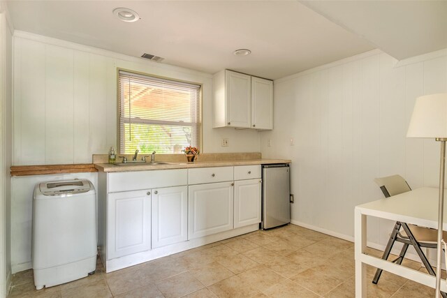 3 Twig Ct, East Setauket, NY 11733 - kitchen featuring light countertops, white cabinetry, and stainless steel refrigerator