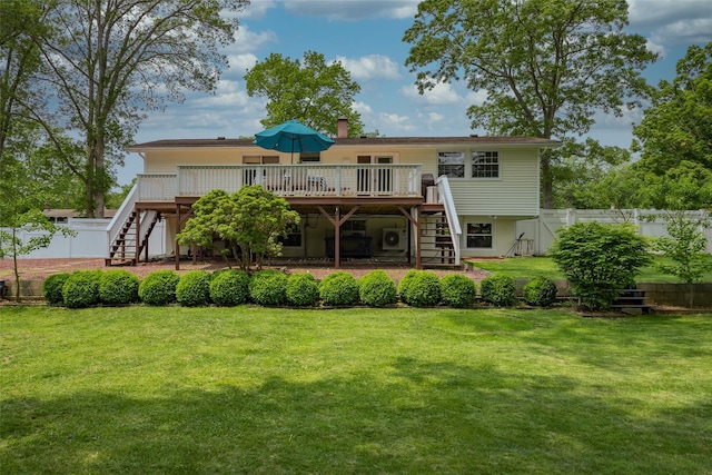 3 Twig Ct, East Setauket, NY 11733 - rear view of house with stairway, a wooden deck, and a chimney