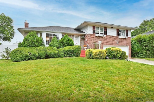 19 Goldfield St, Melville, NY 11747 - tri-level home featuring a chimney, a garage, brick siding, and a front yard