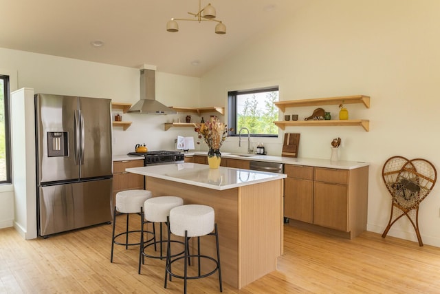 612 Beechwoods Rd, Callicoon, NY 12723 - kitchen featuring open shelves, stainless steel appliances, ventilation hood, a kitchen island, and light wood-style floors