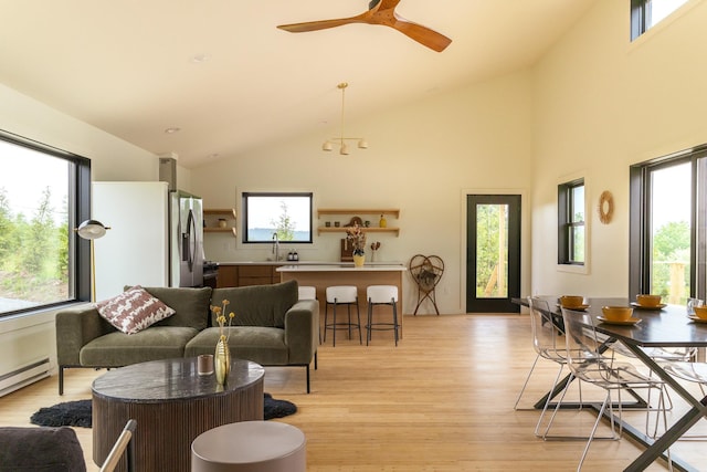 612 Beechwoods Rd, Callicoon, NY 12723 - living area with light wood-style flooring, a baseboard heating unit, ceiling fan, and high vaulted ceiling