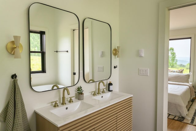612 Beechwoods Rd, Callicoon, NY 12723 - bathroom with connected bathroom, double vanity, and wood finished floors