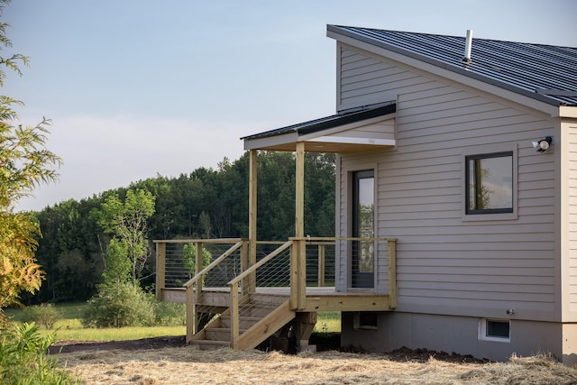 612 Beechwoods Rd, Callicoon, NY 12723 - view of side of property with a deck, a metal roof, and a surveillance system