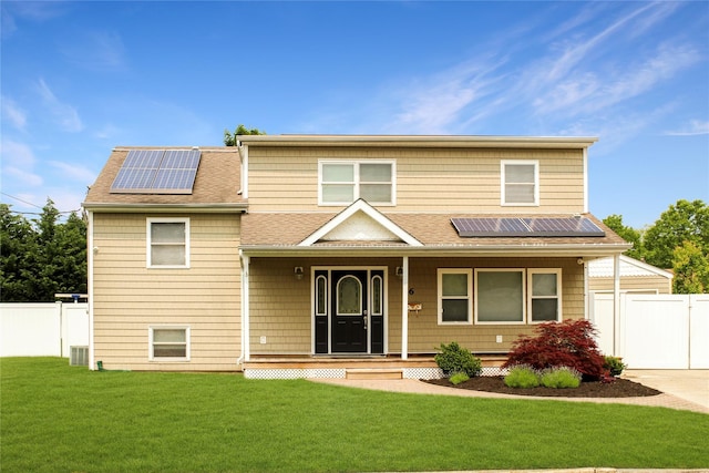 6 Robinhood Dr, East Islip, NY 11730 - view of front of property featuring a shingled roof, covered porch, solar panels, a gate, and concrete driveway