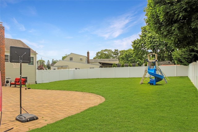 6 Robinhood Dr, East Islip, NY 11730 - fenced backyard with a playground and a patio area