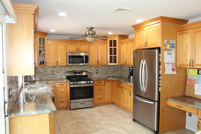 6 Robinhood Dr, East Islip, NY 11730 - kitchen with stainless steel appliances, ceiling fan, light stone countertops, tasteful backsplash, and light tile patterned flooring
