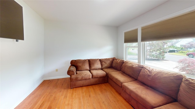 6 Robinhood Dr, East Islip, NY 11730 - living area with light wood finished floors and baseboards