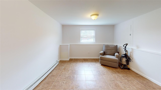 6 Robinhood Dr, East Islip, NY 11730 - sitting room with a baseboard heating unit and baseboards