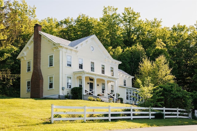 132 Decker, Ancram, NY 12502 - view of front of property featuring a chimney, covered porch, and view of scattered trees