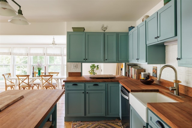 132 Decker, Ancram, NY 12502 - kitchen featuring wood counters, stainless steel dishwasher, green cabinetry, and decorative backsplash