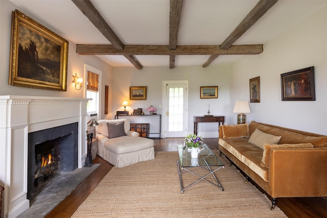 132 Decker, Ancram, NY 12502 - living room with wood finished floors, a lit fireplace, and beamed ceiling