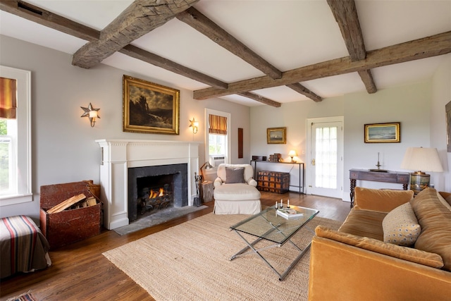 132 Decker, Ancram, NY 12502 - living area with wood finished floors, a fireplace with flush hearth, and beamed ceiling