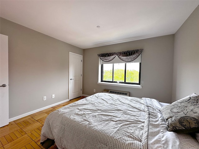 1600 Parkview Ave Unit 6A, Bronx, NY 10461 - bedroom featuring baseboards and an AC wall unit