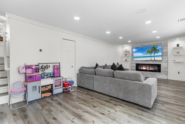 270 Farmers Ave, Lindenhurst, NY 11757 - living room with crown molding, a large fireplace, wood finished floors, and recessed lighting