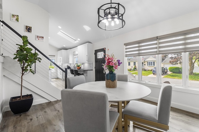 270 Farmers Ave, Lindenhurst, NY 11757 - dining room with stairs, vaulted ceiling, light wood-style floors, and recessed lighting