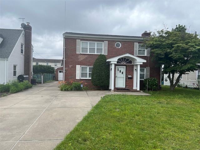 8 Gables Rd, Hicksville, NY 11801 - view of front of house featuring brick siding, a front yard, driveway, a garage, and a chimney