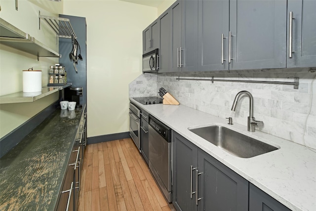 25 Leroy Pl Unit 508, New Rochelle, NY 10805 - kitchen with appliances with stainless steel finishes, decorative backsplash, light wood-style flooring, and light stone counters