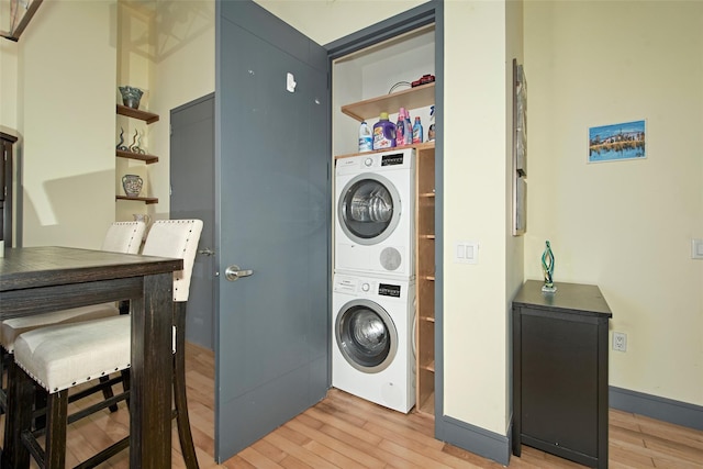 25 Leroy Pl Unit 508, New Rochelle, NY 10805 - washroom featuring stacked washer / drying machine and light wood finished floors