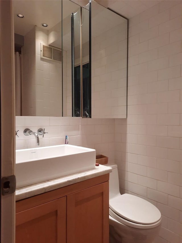 33-47 91st St Unit 5A, Jackson Heights, NY 11372 - bathroom with tile walls, vanity, and recessed lighting
