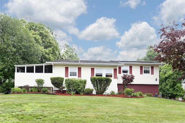 24 Oxford Ct, Spring Valley, NY 10977 - ranch-style house with a front yard and brick siding