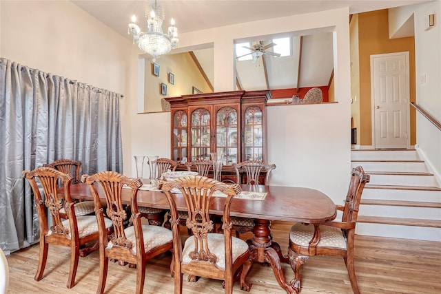 24 Oxford Ct, Spring Valley, NY 10977 - dining area featuring wood finished floors, stairway, a ceiling fan, and a chandelier