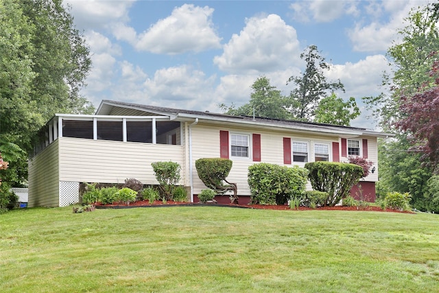 24 Oxford Ct, Spring Valley, NY 10977 - view of front of house featuring a front yard and a sunroom