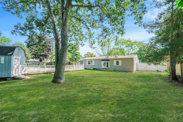 16 Marlin Rd, Centereach, NY 11720 - fenced backyard with a storage shed and a deck
