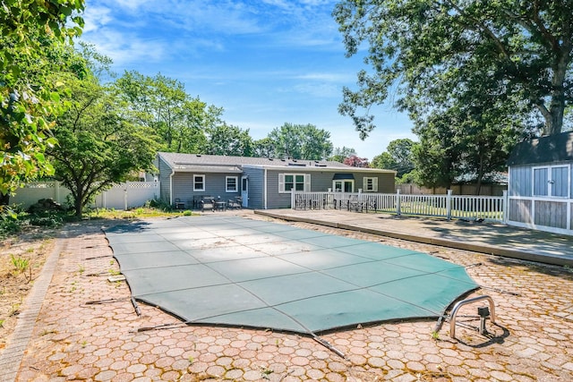 16 Marlin Rd, Centereach, NY 11720 - back of house featuring a deck, a fenced backyard, a patio, and a shed