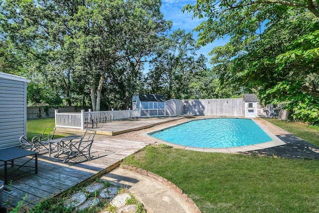 16 Marlin Rd, Centereach, NY 11720 - view of swimming pool with a storage unit, a wooden deck, and a fenced backyard