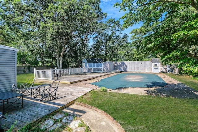 16 Marlin Rd, Centereach, NY 11720 - view of swimming pool featuring a wooden deck, a shed, and a fenced backyard