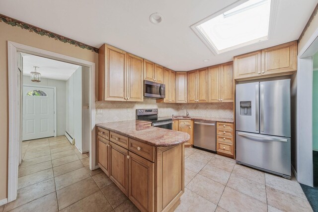 16 Marlin Rd, Centereach, NY 11720 - kitchen with stainless steel appliances, decorative backsplash, light tile patterned floors, and light stone countertops