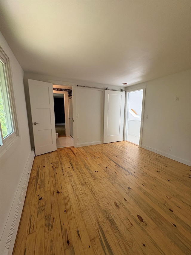 165 Roses Grove Rd, Water Mill, NY 11976 - unfurnished bedroom with light wood-type flooring and baseboards