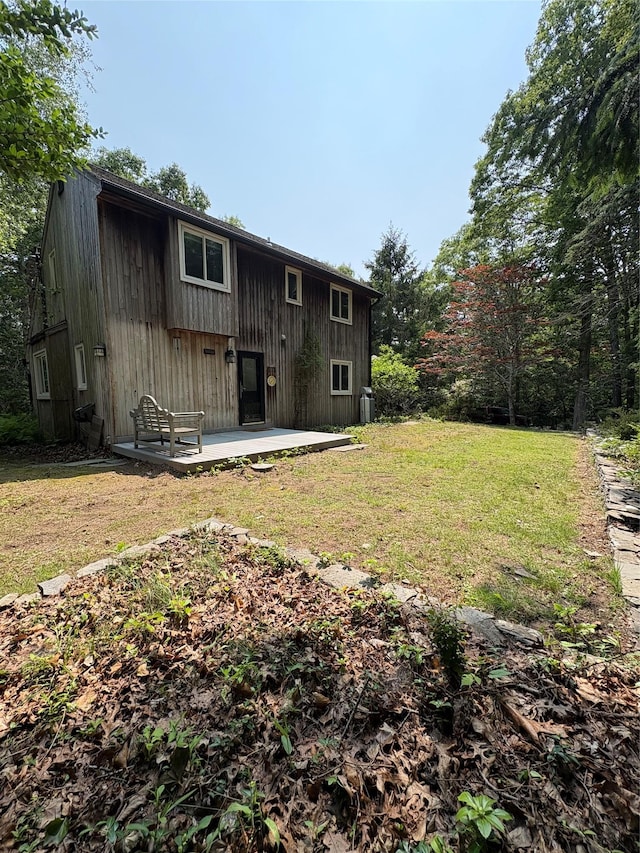 165 Roses Grove Rd, Water Mill, NY 11976 - rear view of property with a patio area and a yard