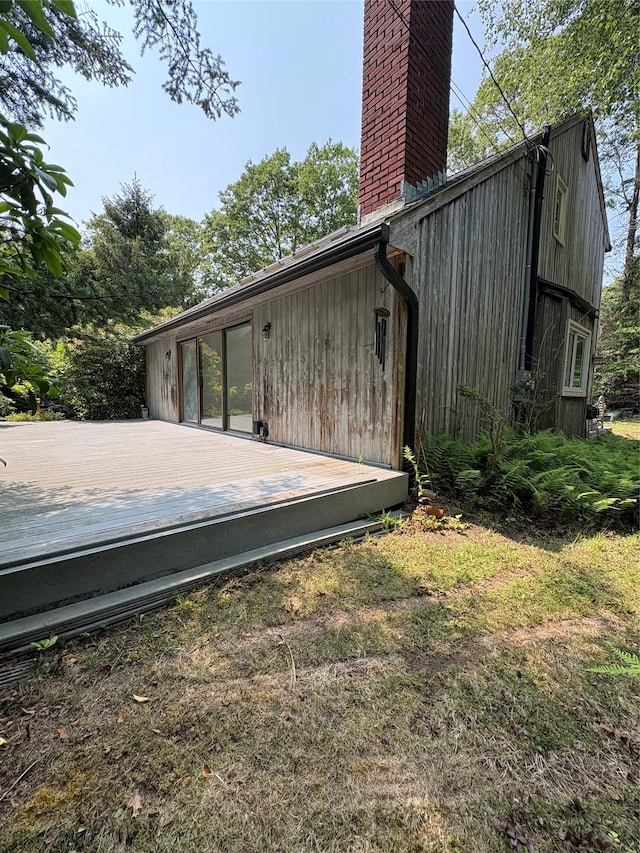 165 Roses Grove Rd, Water Mill, NY 11976 - back of property featuring a chimney and a deck