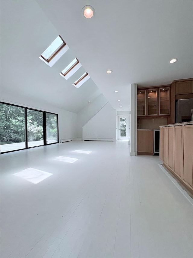 165 Roses Grove Rd, Water Mill, NY 11976 - unfurnished living room featuring a skylight, recessed lighting, and lofted ceiling